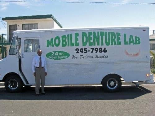 The Mobile Denture Lab van with 24 hr. repair service signage